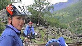 The group at Vetleøyna, where the Rallarvegen, railway and River Myrdøla all cross at the Cave Waterfall, 44.8 miles into the ride